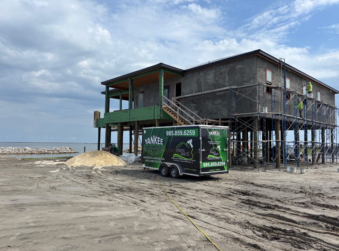 Coastal elevated camp spray foam South Louisiana both trailers on site