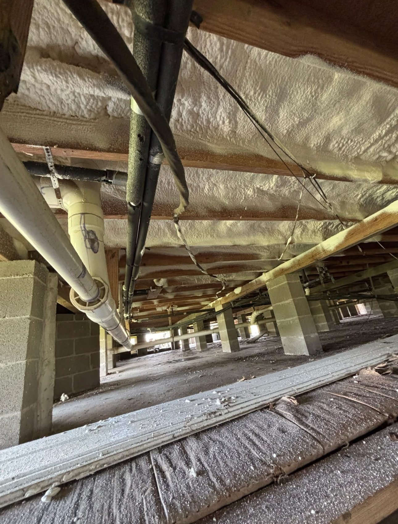 Crawlspace spray foam insulation subfloor South Louisiana elevated home