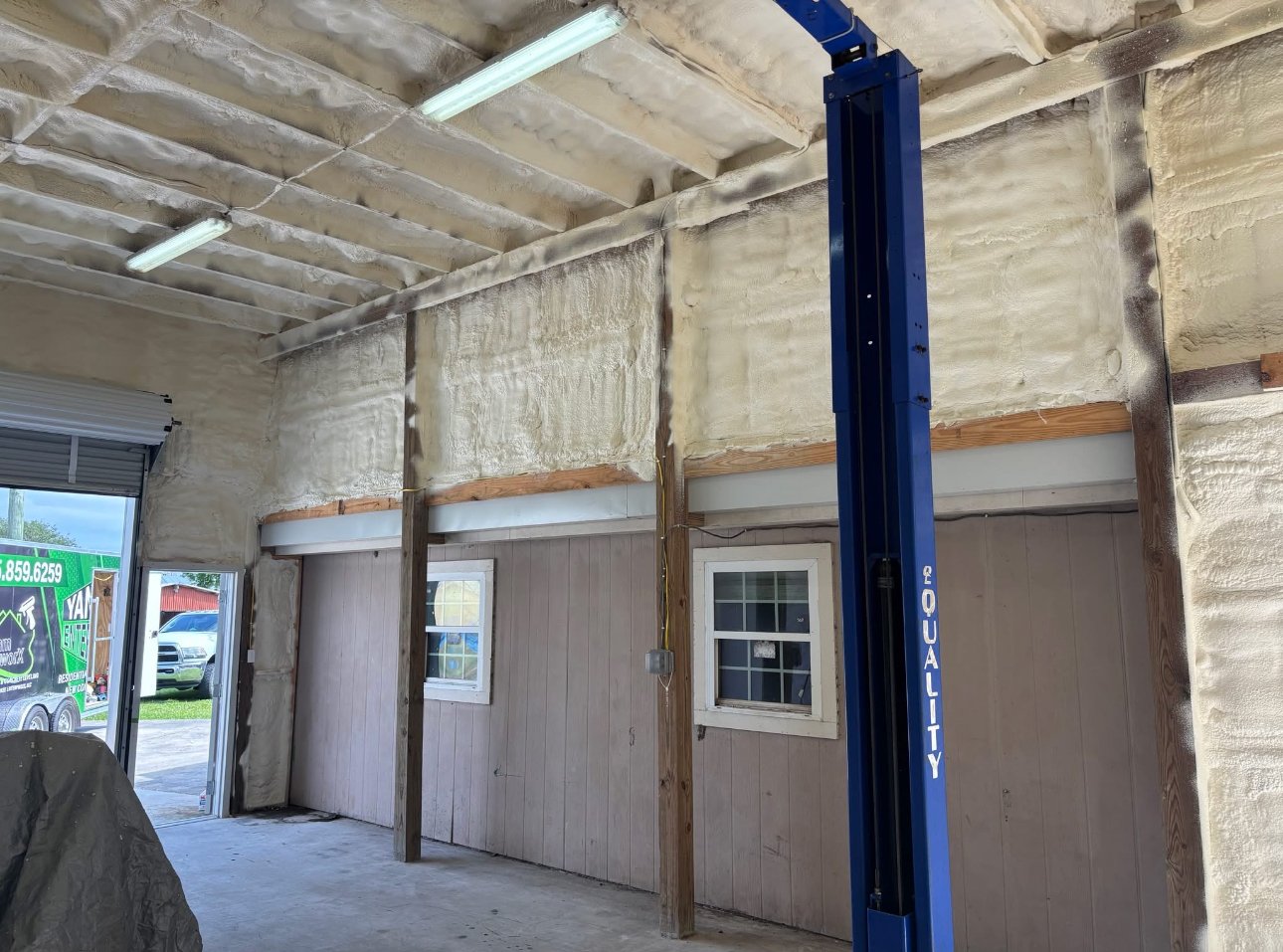 Metal building auto shop spray foam insulation complete